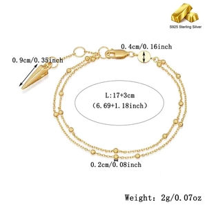 Detail view of double-layer S925 silver chain bracelet with golden beads and cone pendant