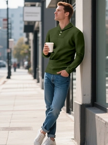 Detail view of dark green waffle knit texture and two-button collar on a long sleeve polo