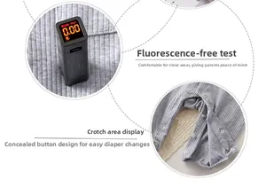 Detail of baby romper showing fluorescent-free test results and snap button crotch design