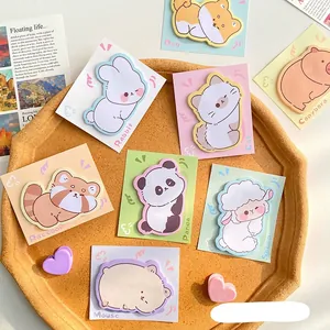 Cute cartoon animal sticky notes featuring panda and cat designs in a warm tray display