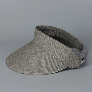 Detail of dark grey woven raffia sun hat showing texture and elastic adjustable strap