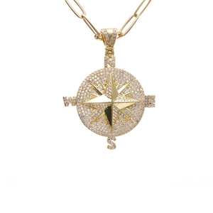 Gold compass pendant necklace with white crystals on a paperclip chain for women