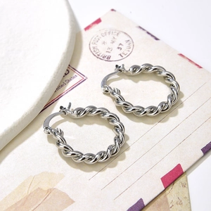 Silver twisted rope hoop earrings featuring a classic metallic spiral design for women