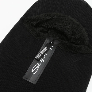 Detail of black winter knit balaclava with warm faux fur lining and branded zipper