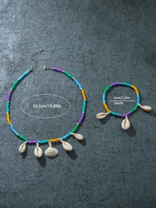 Detail view of bohemian beaded jewelry set with shell pendants and size measurements