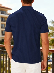 Detailed back view of navy blue vertical striped knit polo shirt on a vacation balcony