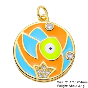 Detail of colorful enamel crown charm with sparkling cubic zirconia in gold setting