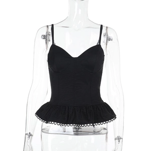 Detail of black corset camisole with sweetheart neckline and ruffled hem on mannequin