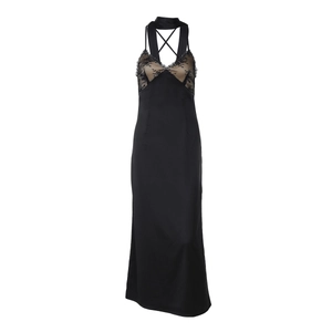 Detail of cross back straps and lace bodice on a sexy black slim fit long dress