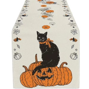 Halloween linen table runner with black cat on pumpkin and spooky bat patterns