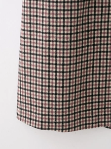 Close-up of elegant plaid fabric texture with black and purple woven pattern detail