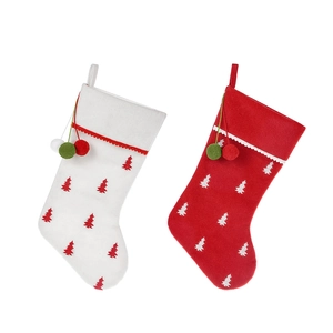 Large felt Christmas stocking gift bags with tree patterns and decorative hanging pom-poms