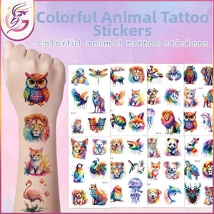 Close-up of colorful watercolor animal tattoo stickers featuring cats and owls