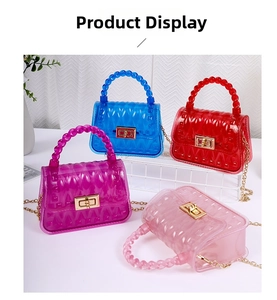 Close-up of four transparent PVC jelly bags with leaf textures and gold chain straps