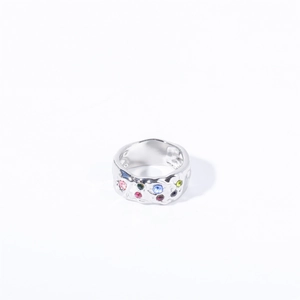 Irregular hammered silver ring with vibrant colorful zircon stones on white background