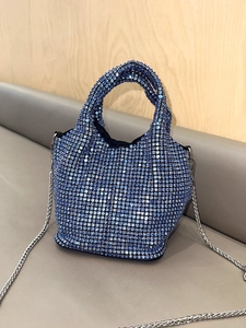 Sparkling blue rhinestone bucket bag with silver chain strap and top handle for parties