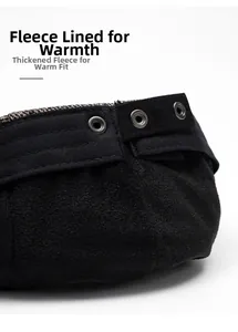 Detailed macro view of the black beret featuring thick fleece lining and metallic eyelets