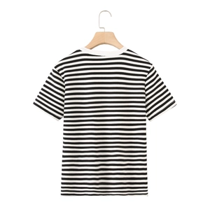 Back view of black and white striped short sleeve t-shirt hanging on a wooden hanger