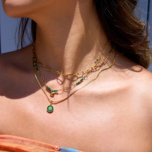 Layered 18K gold stainless steel necklace featuring green natural stones and heart pendants