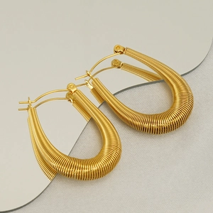 Textured 18K gold U-shaped hoop earrings with unique spiral thread design for women