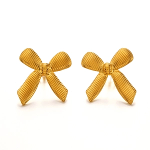 Hip hop style 18K gold plated bow earrings with textured surface on white background