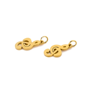 Detailed view of two gold treble clef music note pendants on a clean white background