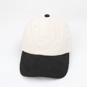 Top view of color-block corduroy baseball cap with white crown and black visor detail