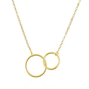 Detailed view of interconnected golden metal rings on a minimalist pendant necklace