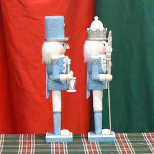 30cm blue glitter wooden nutcracker king figures on festive red and green background