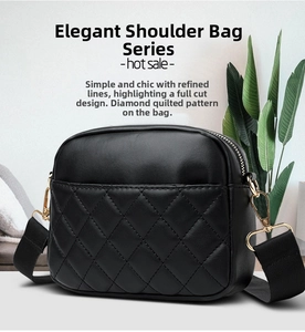 Detail of black quilted shoulder bag featuring gold hardware and wide woven strap