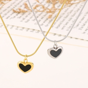 Elegant gold and silver snake chain necklaces featuring stylish black heart pendants