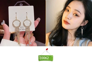 Detail view of S925 silver needle golden tassel earrings with sparkling rhinestone chains