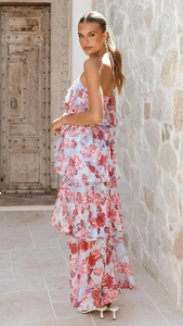 Detail of floral chiffon tiered maxi dress featuring halter neck and romantic ruffled layers