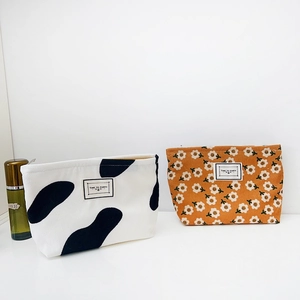 Vintage floral corduroy makeup bag set with cow print and flower patterns in travel size
