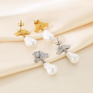 Bow-knot stainless steel stud earrings with baroque pearls in gold and silver finish