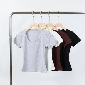 U-neck fitted t-shirts in grey, white, brown and black shown on premium wooden hangers