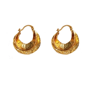 Golden chunky hoop earrings with hand-hammered texture on professional white background