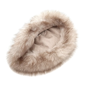 Close-up of camel faux fur winter bucket hat with soft fleece lining texture