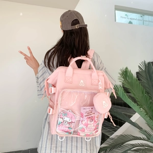 Rosa Ita-Rucksack mit großem Sichtfenster und rundem Anhänger für Sammlerstücke