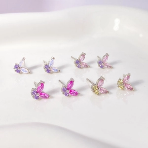Macro shot of colorful butterfly stud earrings with marquise-cut cubic zirconia in four shades