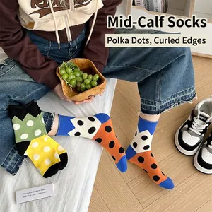 Women's Japanese style polka dot crew socks with colorful contrast and rolled edges