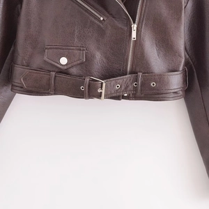 Women's cropped brown PU leather biker jacket with metal zipper and adjustable belt detail