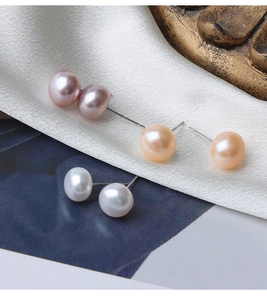 Macro detail of high-luster natural freshwater pearl earrings with S925 silver needles