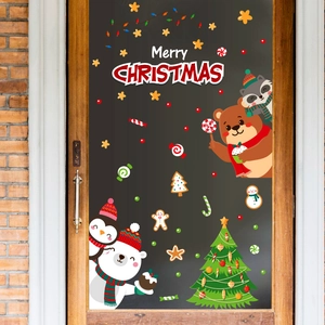 Festive Christmas window stickers featuring polar bears and penguins on glass doors