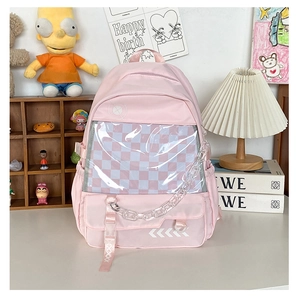 Detail view of pink student backpack with clear front pocket and acrylic chain
