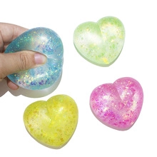 Glitter heart-shaped squishy stress relief toy with glowing LED light detail