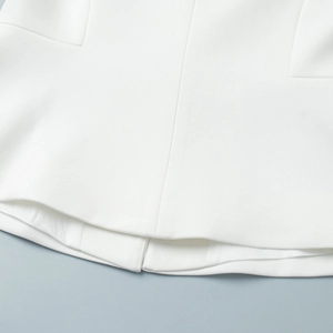 Close-up of the professional white vest suit hem stitching and high-density fabric