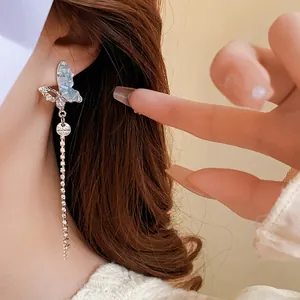 Sparkling butterfly tassel earrings with rhinestones for a graceful asymmetric jewelry look