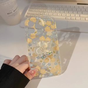 Detailed close-up of a floral iPhone case featuring a glitter sand flower phone grip