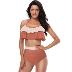 Two-piece terracotta ruffled bikini set with high-waisted bottoms and halter neck top
